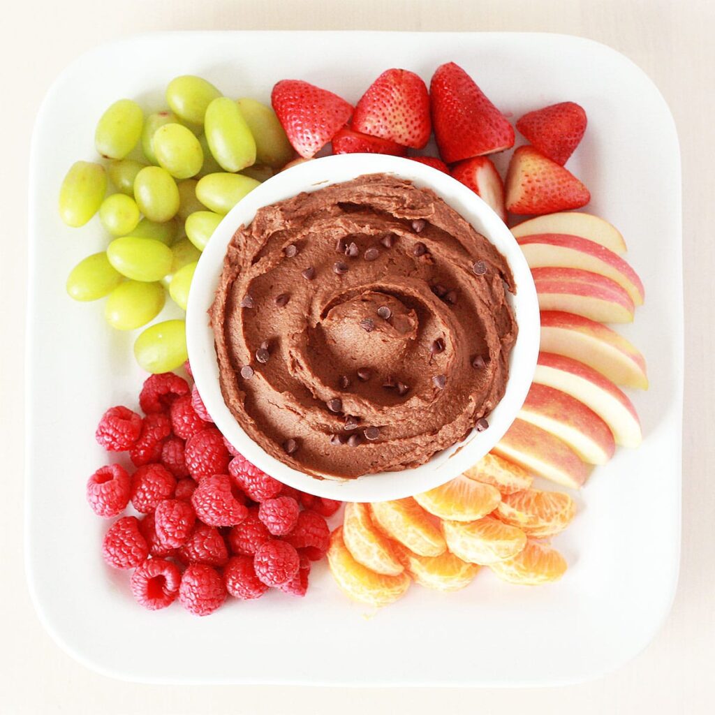 chocolate hummus or strawberry yogurt dip paired with an array of fruit slices